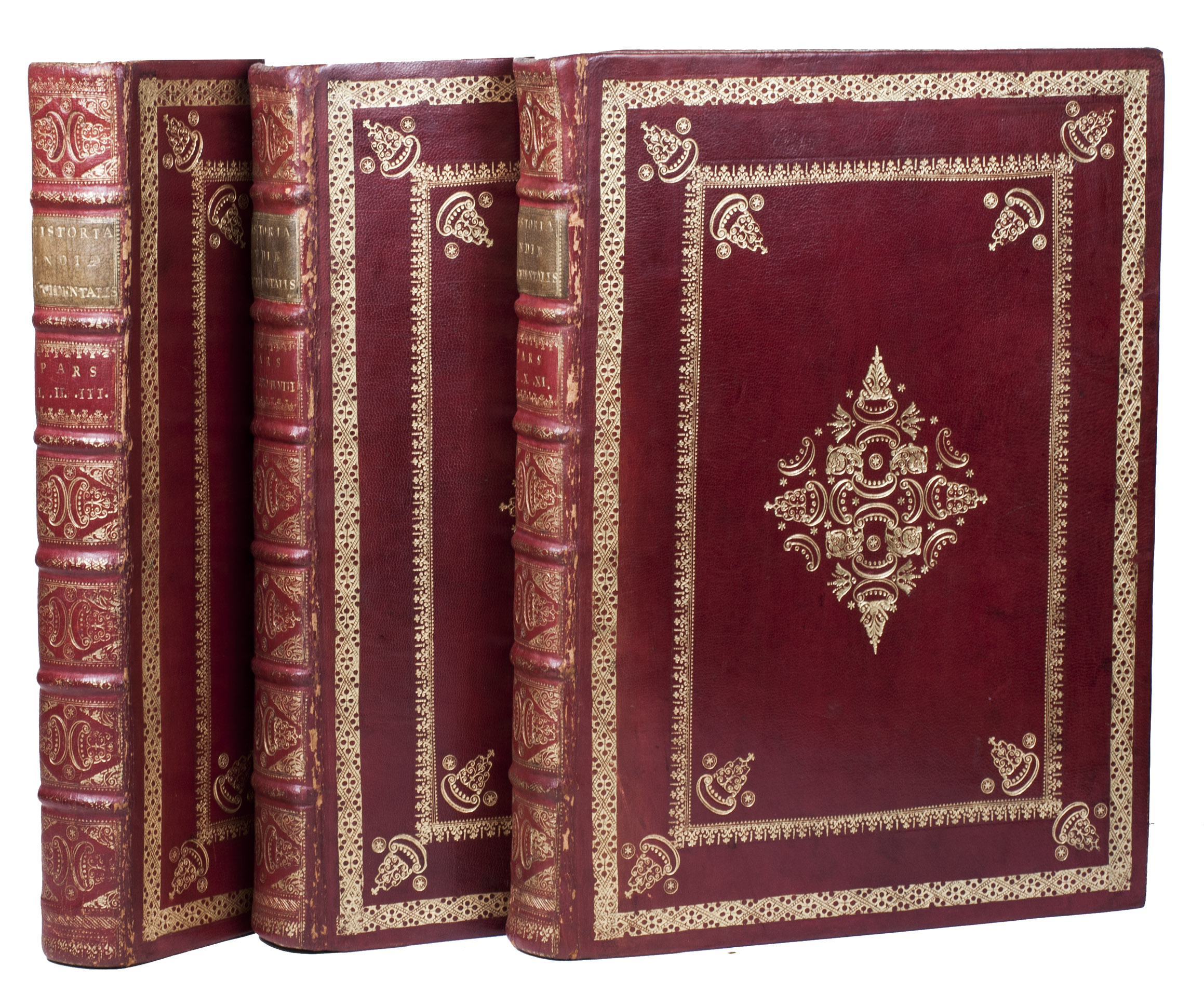 BRY, Theodor de. - [The great voyages in Latin].Frankfurt am Main and Oppenheim, Johann Wechel, Matthias Becker, Johann Feyrabend, Hieronymus Galle and Johannes Hofer, 1590-1620. 11 parts in 3 volumes. Folio (ca. 33 x 23.8 cm). With 11 maps (mostly folding), 300 engraved plates (double-page, full-page and in text), engraved title pages to each part, numerous decorated woodcut initials, and numerous woodcut head- and tailpieces. 18th-century gold-tooled Dutch red morocco, bound by the Double Drawer Handle Bindery in Amsterdam, gold-tooled spines, with green morocco title labels lettered in gold, marbled edges, marbled endpapers.