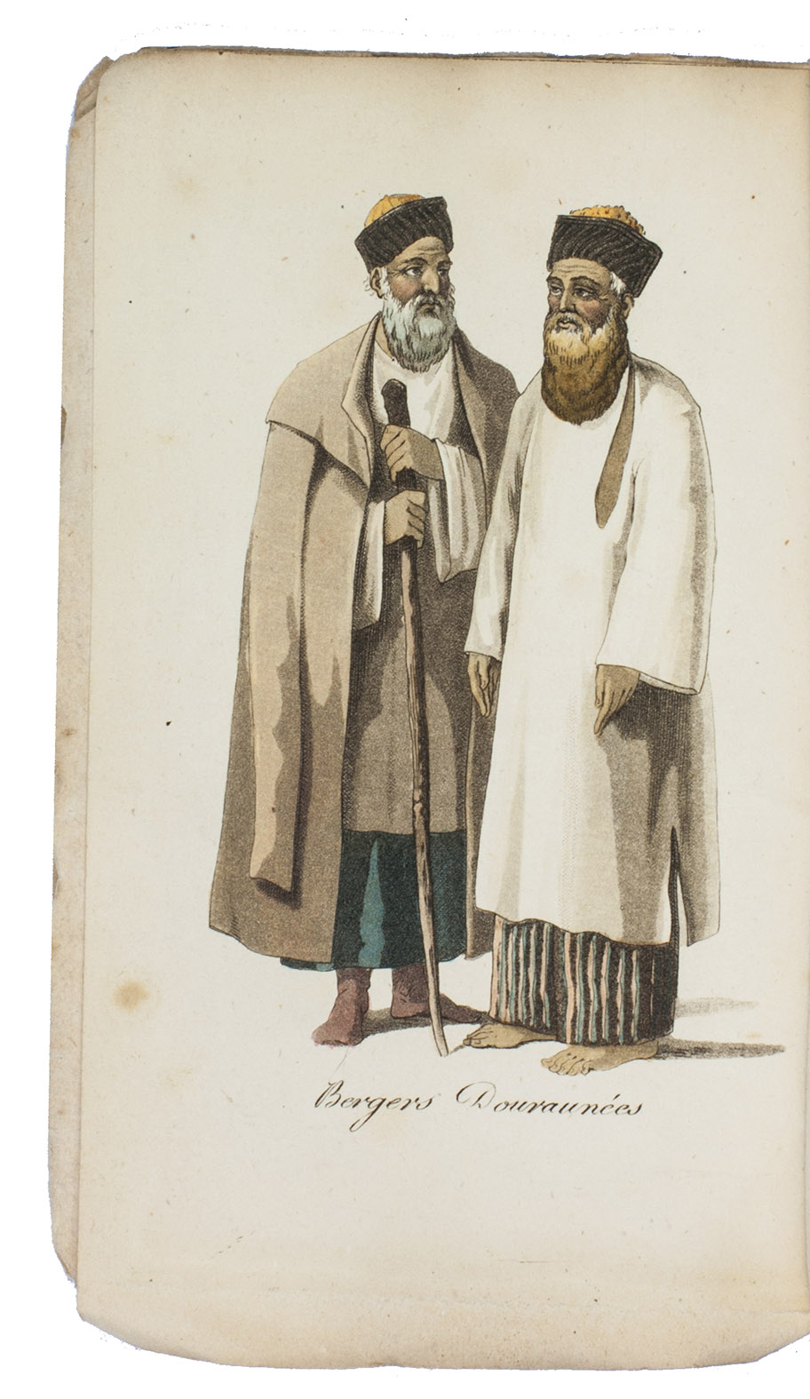 ELPHINSTONE, Mountstuart. - Tableau du royaume de Caboul, et de ses dpendances, dans la Perse, la Tartarie et l'Inde, offrant les moeurs, usages et costumes de cet empire,  traduit et abrg de l'anglais, par M. Breton.Paris, Nepveu, 1817. 3 volumes. 18mo. With 14 engraved plates depicting various costumes, lords on horseback, etc., all beautifully coloured by hand. Original publisher's printed wrappers, each volume with wood engraved illustrations on front, back and spine. Preserved in a modern gold-tooled green morocco box.