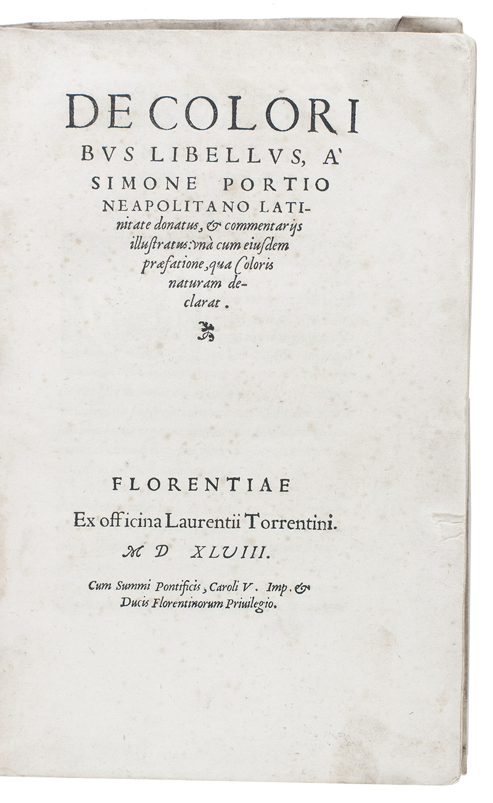 [THEOPHRASTUS? (pseudo ARISTOTLE)] and Simone PORZIO. - De coloribus libellus,  Simone Portio Neapolitano latinate donatus, & cometariis illustratus: una cum euisdem praefatione, qua coloris naturam declarat.Florence, Lorenzo Torrentino, 1548. 4to. With 2 large woodcut historiated initials. Contemporary limp sheepskin parchment, manuscript spine-title, with 4 fragments of a Latin manuscript in an upright humanistic hand on vellum used as spine lining.