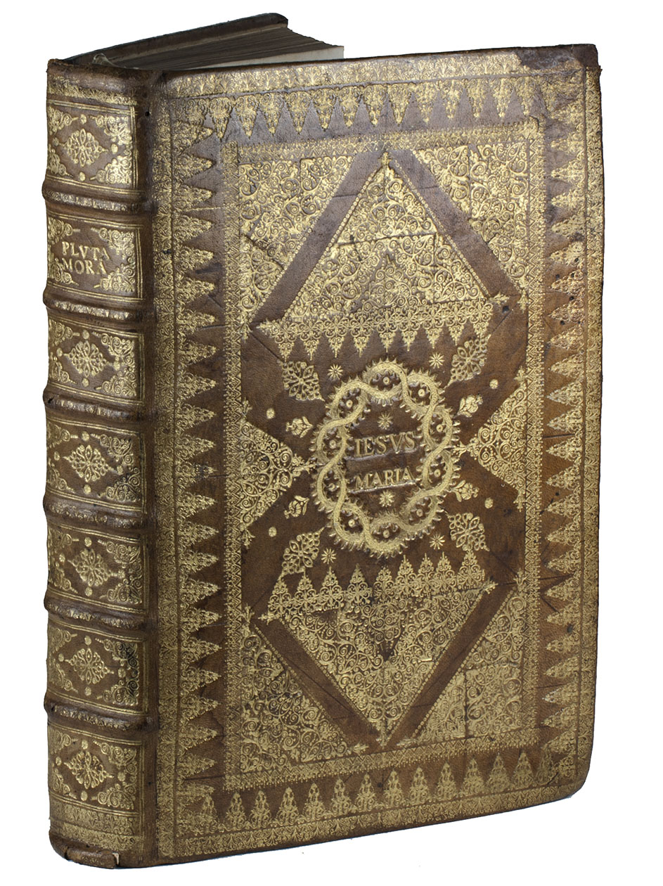 PLUTARCHUS. - Moralia, quae usurpantur. sunt autem omnis elegantis doctrinae penus: id est, varij libri: morales, historici, physici, mathematici, deniq; ad politiorem litteraturam pertinentes & humanitatem: omnes de Graeca in Latinam linguam transscripti. Basel, Thomas Guarini, 1570. Folio. With woodcut printer's device on title-page and repeated on last page, some mathematical woodcuts in text and numerous historiated woodcut initials. Early 17th-century Jesuit prize binding in richly gold-tooled light brown calf, sides with arabesques in the style of Gascon, richly gold-tooled double borders and inner panel with small bands in a geometrical pattern.
