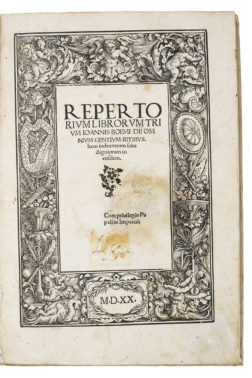 BOEMUS (BHM), Johannes. - Omnium gentium mores leges et ritus ex multis clarrissimis rerum scriptoribus ... nuper collecti: & in libros tris distinctos Aphricam, Asiam, Europam, optime lector lege. [Half-title:] Repertorium librorum trium Ioannis Boemi de omnium gentium ritibus. Item index rerum scitu digniorum in eosdem. Cum privilegio Papali ac Imperiali M.D.XX.(Colophon: Augsburg, Sigismund Grimm & Marcus Wirsung, July 1520). Folio. With the letterpress half-title in an elaborate woodcut border with a trophy of arms, putti and mermen. 17th century vellum with 3 raised spine-bands.