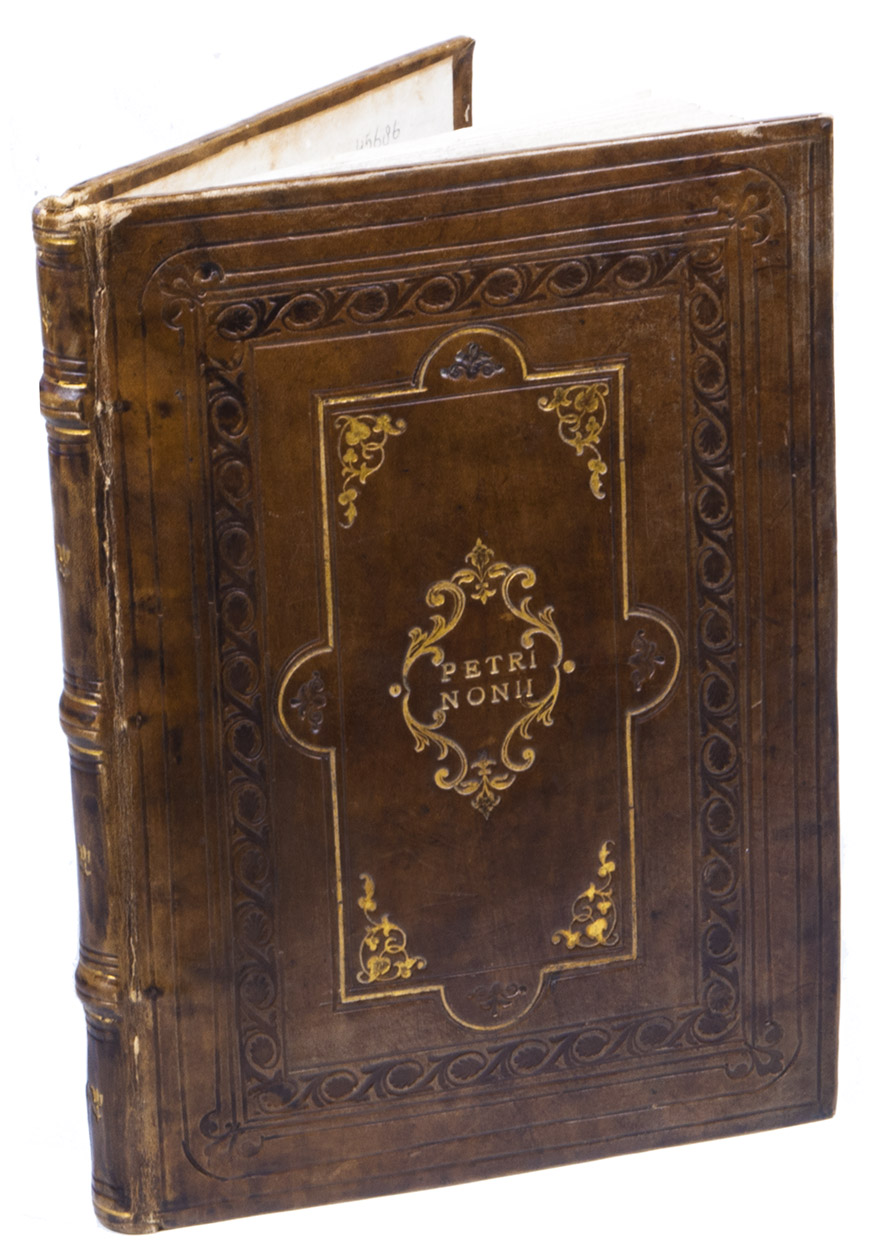 NUNES, Pedro. - De crepusculis liber unus, nu[n]c rece[n]s & natus et editus.Including: [Abu 'Abd Allah Muhammad ibn MU'ADH] (mis-attributed to Ibn AL-HAYTHAM). De causis crepusculorum liber unus,  Gerardo Cremonensi iam olim Latinita te donatus, nunc vero omniu[m] primum in lucem editus.(Colophon: Lisbon, Ludovicus Rodericus, January 1542). 4to. With woodcut architectural title-page with an arch containing putti and mythological figures (including 2 winged female fauns holding drapery, with the Royal Portuguese coat of arms at the foot and an armillary sphere at the head, 40 woodcut diagrams concerning astronomy, spherical geometry, optics and geodessy in the text, Rodericus's spectacular full-page emblematic woodcut device (a dragon with the motto 