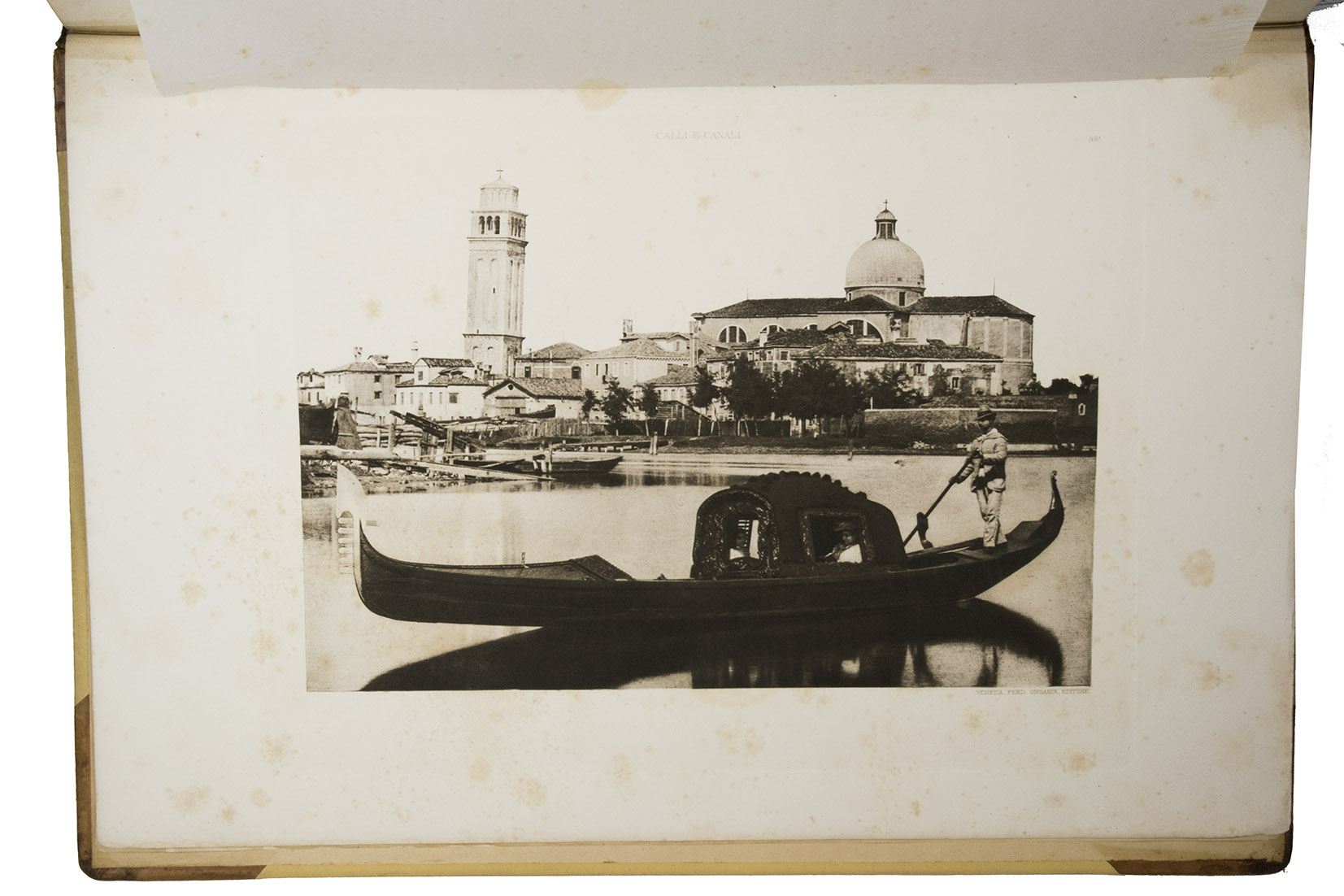 ONGANIA, Ferdinando (ed.). - Calli e canali e isole della laguna [frontispiece: Calli et canali in Venezia].Venice, Tipografia Emiliana, 1894-1895. Imperial folio (ca. 55 x 37 cm). With a lithographed frontispiece showing a gondola in a Venice canal and 100 colletypes of the Venice canals, streets and buildings, mounted on guards and covered with flyleaves, index printed in red and black. Original publishers half brown sheepskin, beige cloth sides with blind-tooled frame on the front and back board and with a centrepiece with a boat in the lagoon of Venice and the gold-stamped title and author's name on the front board.