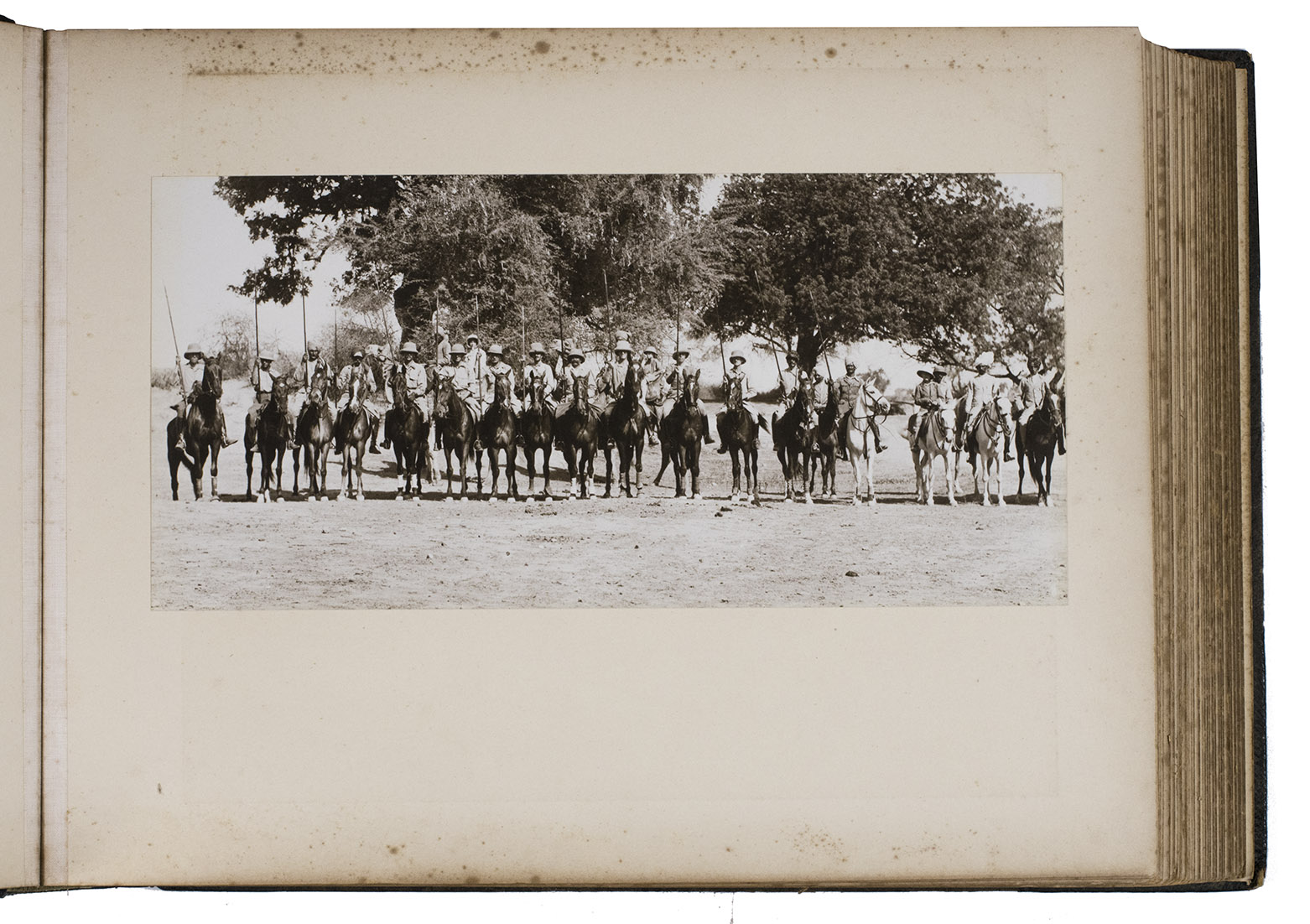 [PHOTOGRAPHY - INDIA - HUNTING]. - [Photograph album showing hunting society in Britsh India].[Cambridge, Mumbai, New Delhi], Scott & Wilkinson, Clifton & Co, Hamilton Studios and Kinsey Bros., [ca. 1933-1935]. With 105 photographs mounted in the album (ranging from 16 x 28 cm to 4 x 6 cm), 2 photographs loosely inserted and a watercolour mounted at the back (11.5 x 21 cm).  Oblong half morocco photograph album by W. Johnson & sons, London.