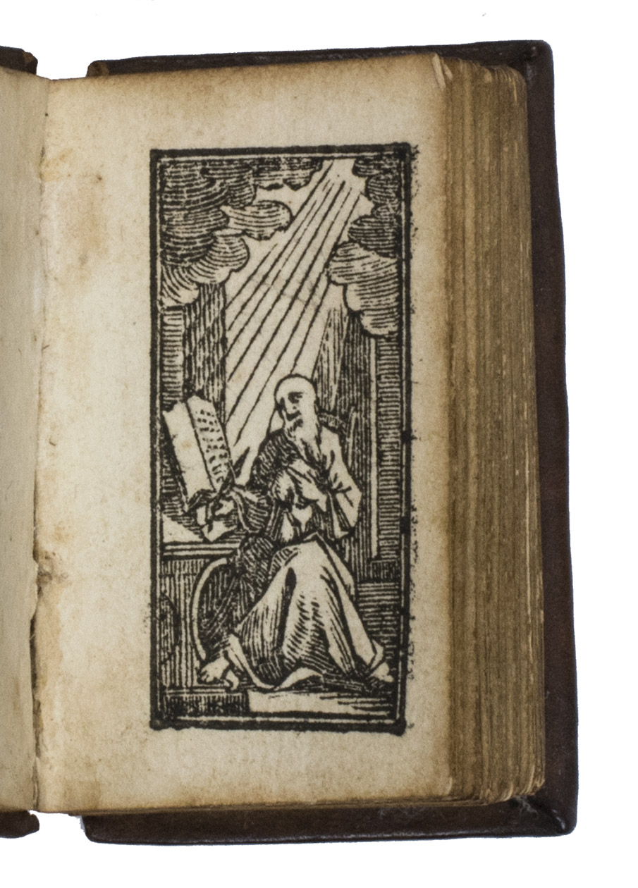 [MINIATURE BOOK - BIBLE]. - Kern des Bybels.The Hague, Anthoni de Groot and sons, 1750. 128mo (or possibly 96mo) in 4s (4.5 x 3 x 1 cm). Title-page in red and black with a woodcut title-vignette (an open book on a shell, with decorations), 7 full-page (3.3 x 1.6 cm!) woodcuts depicting important scenes from the Bible (1 as frontispiece and 1 opening each of the 5 books and the appendix). Contemporary gold-tooled calf.