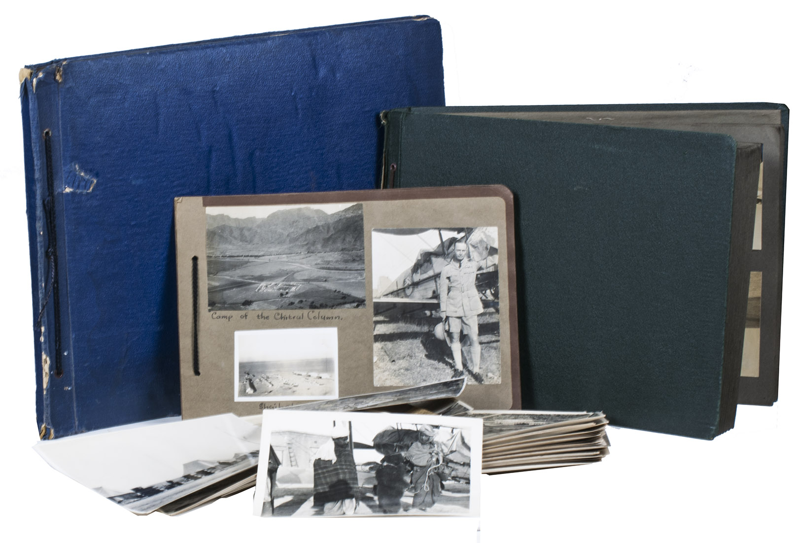 [PHOTOGRAPHS - PAKISTAN & INDIA - BRITISH ROYAL AIR FORCE]. EADY, Thomas William George. - [RAF aircraft, pilots, etc. during the Afridi Redshirt Rebellion on Indias North-West Frontier].[India and Pakistan, especially their border region], 1929-1930. A collection of photographic silver-gelatin prints of aircraft, the squadron, aerial reconnaissance etc., made and compiled by Thomas William George Eady, flying officer of the no. 28 Squadron of the RAF. It comprises 3 photo albums (contemporary with the photos), 53 loose photos (20 x 15 cm, some with manuscript comments on the back), 5 related documents (dated 1928-1932) and a separate photographic portrait of Eady, in total nearly 2000 prints. The first and largest album, covers 1929, oblong folio (30 x 39.5 cm) in blue cloth with brown cord ties, contains 183 prints in various sizes, mounted on 16 brown paper leaves with India ink captions by Eady in English. The second album, oblong 4to (33.5 x 24 cm) in green cloth with brown cord ties, contains 72 prints made during the Afridi Redshirt Rebellion, in various sizes and mounted on 20 brown paper leaves with neat India ink captions in English by Eady. The small third album, oblong small 4to (19 x 27 cm), consisting of 4 brown paper leaves tied together with black cord ties, contains 33 prints in various sizes mounted on the leaves,  some duplicating prints in the largest album, with larger captions in black ink, probably not by Eady.