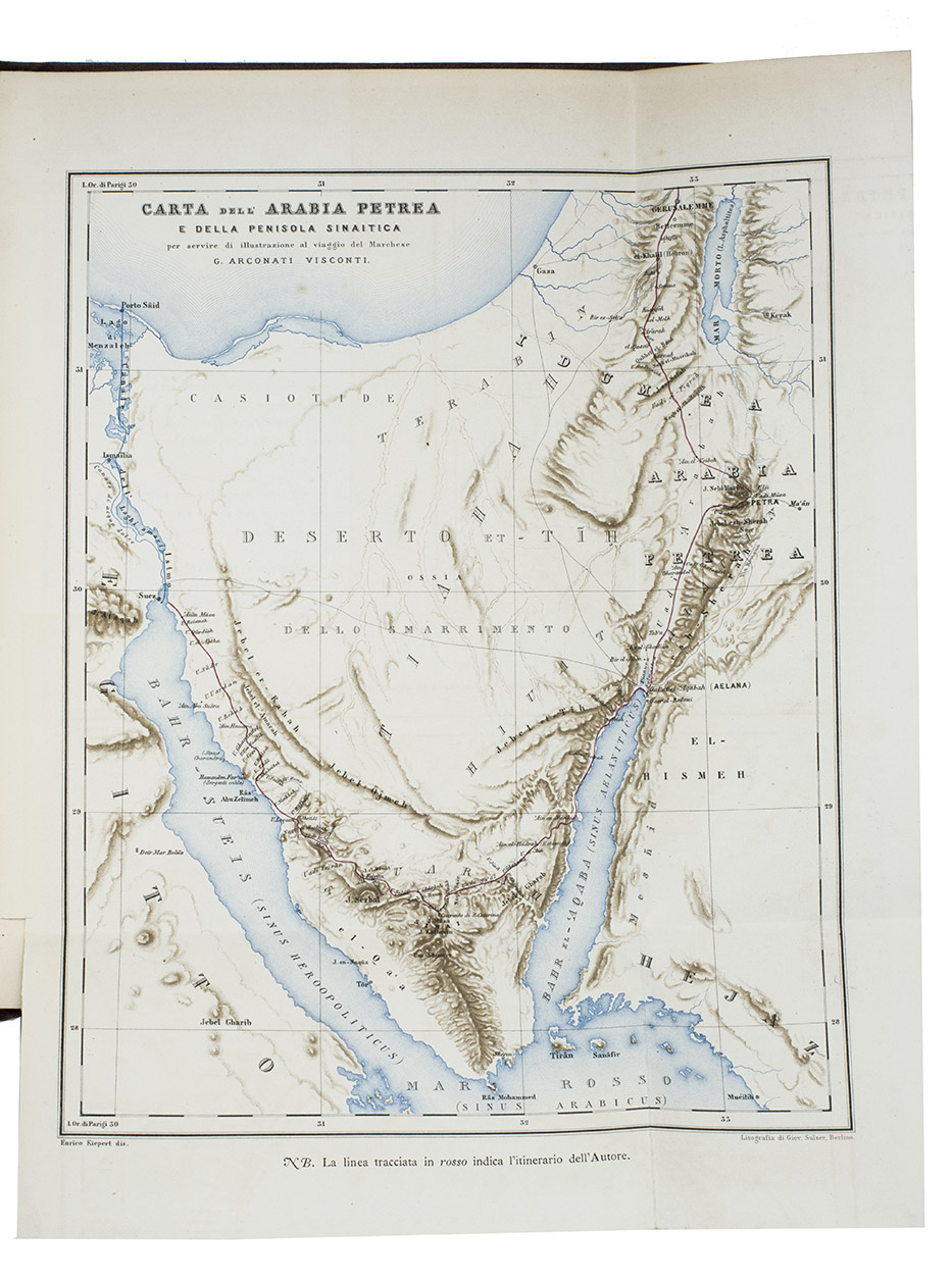 VISCONTI, Giammartino Arconati. - Diario di un viaggio in Arabia Petrea (1865).Including: Atlante per servire al Diario di un viaggio in Arabia Petrea.Torino, Vincenzo Bona, 1872. 2 volumes. Royal 4to (31 x 27 cm). With 2 title-pages printed in red and black, each with the author's wood-engraved decorated GAV-monogram and motto; vol. 1 with 2 folding lithographed maps (1 printed in black, brown and blue, with the route coloured by hand in red, of the Sinai Peninsula; the other in black and white, of the city of Petra); 40 mounted albumen prints after paintings by Emile Pierre Metzmacher (mainly 11.5 x 16 cm), individually mounted with letterpress captions on the mount; and 2 engraved plates; vol. 2 with 6 numbered engraved plates of molluscs and insects. The Diario in the original publisher's maroon cloth with the author's crowned monogram gold--blocked on the front board and spine. The Atlante in the original publisher's blue cloth, with the author's crowned monogram and the title gold-blocked on the front board. Both volumes with gilt edges, orange endpapers and with tissue guard leaves tipped in, protecting the albumen prints and engraved plates.