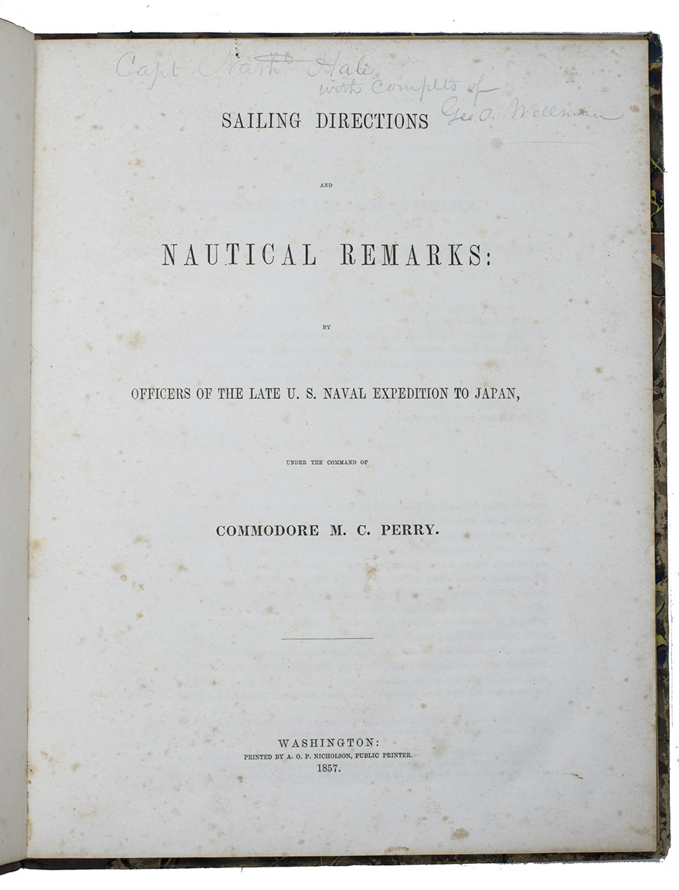MAURY, William Lewis & Silas BENT. - Sailing directions and nautical remarks; by officers of the late U.S. naval expedition to Japan, under the command of Commodore M.C. Perry.Including (with a divisional title): Fac-simile of the original treaty with Japan, with the English version.Washington, A.O.P. Nicholson, public printer, 1857. Large 4to (ca. 29.5 x 23 cm). With a large folding map of the coast of China and of the Japanese and other islands, including the Marianas and the Philippines; and the facsimile of the 14-page treaty in Japanese printed on both sides of 7 integral leaves, with the English text printed letterpress on both sides of the following leaf. Original publishers half purple cloth, Spanish-marbled paper sides (grey with red, blue, black, yellow and white veins), letterpress paper label with the title in a built-up decorative border on the front board: 