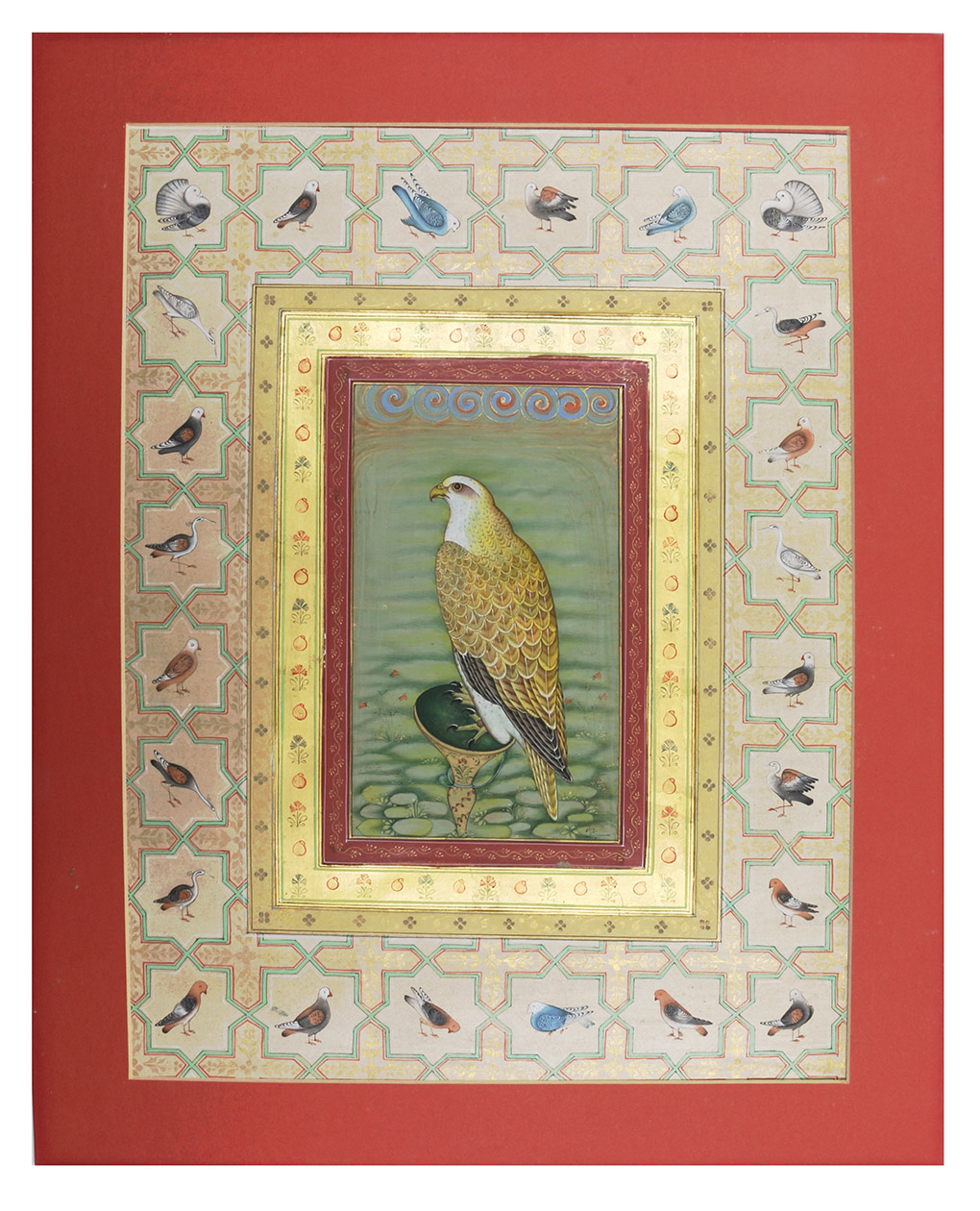 [FALCONRY]. - [A domestic falcon].[India, early 20th century]. Folio card (38.5 x 28 cm). Ink and gouache central painting of a falcon, with 24 smaller bird paintings in the elaborate border, painted on paper mounted on paperboard. Matted, framed and glazed.