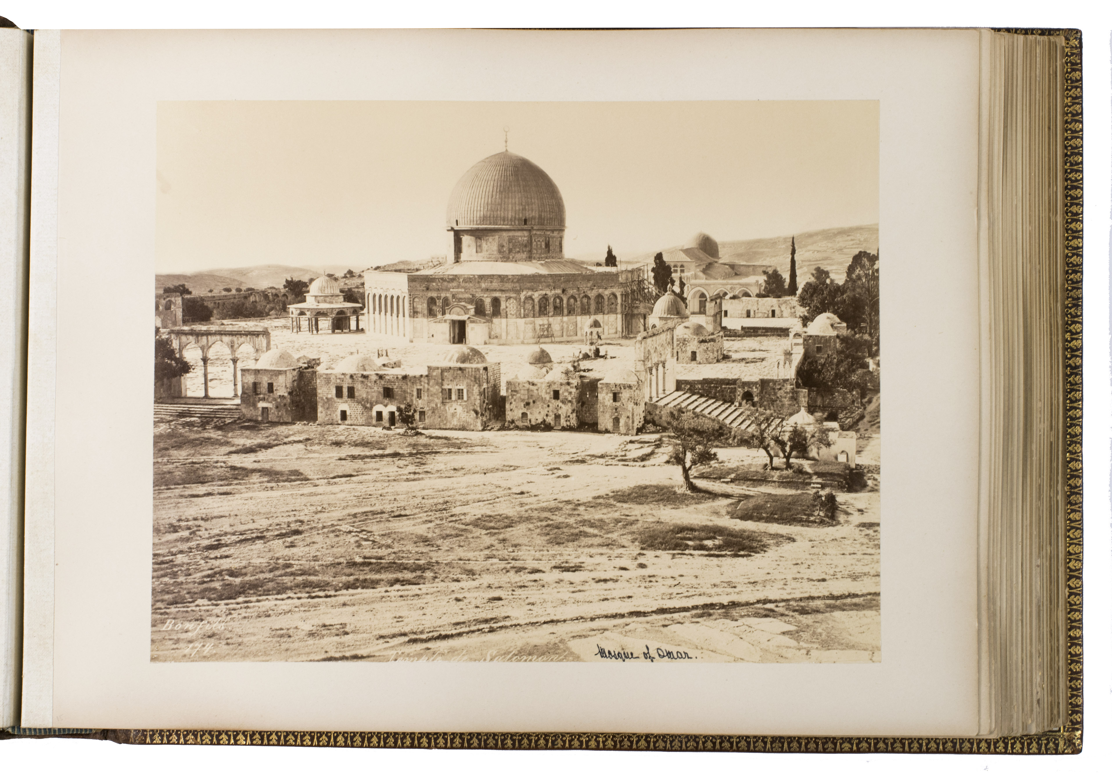 BONFILS, Felix and Pascal SBAH (photographers). - [Photograph album of Palestine, Syria, Turkey and Greece].[Between 1867-1885]. Oblong folio (ca. 28 x 38 cm). With 75 albumen prints, most signed and numbered in the negative. Contemporary gold-tooled reddish-brown morocco over cushioned covers, gold-tooled turn-ins, watered-silk end papers, gilt edges.