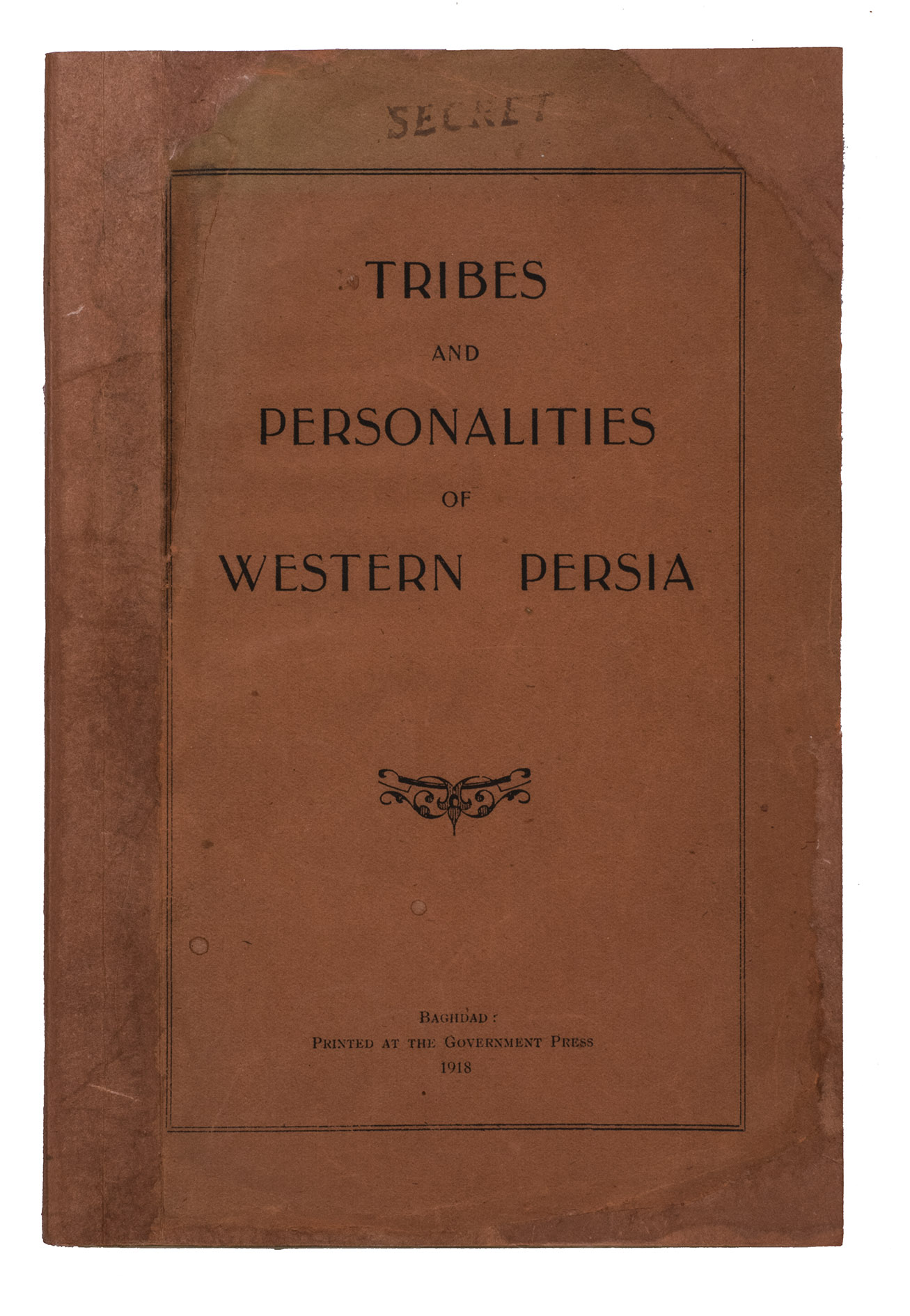 [PERSIA - BRITISH AUTHORITIES - NOTABLE PERSIAN TRIBES & PEOPLE]. - Tribes and personalities of Western Persia.Baghdad, printed at the Government Press, 1918. 8vo. With 2 folding genealogical charts, respectively showing the family trees of the royal Qajar house and the chiefs of the Qaraguzlu tribe, and a printed ornament on the front wrapper. Restored red printed paper wrappers, with a clear plastic protective wrapper.