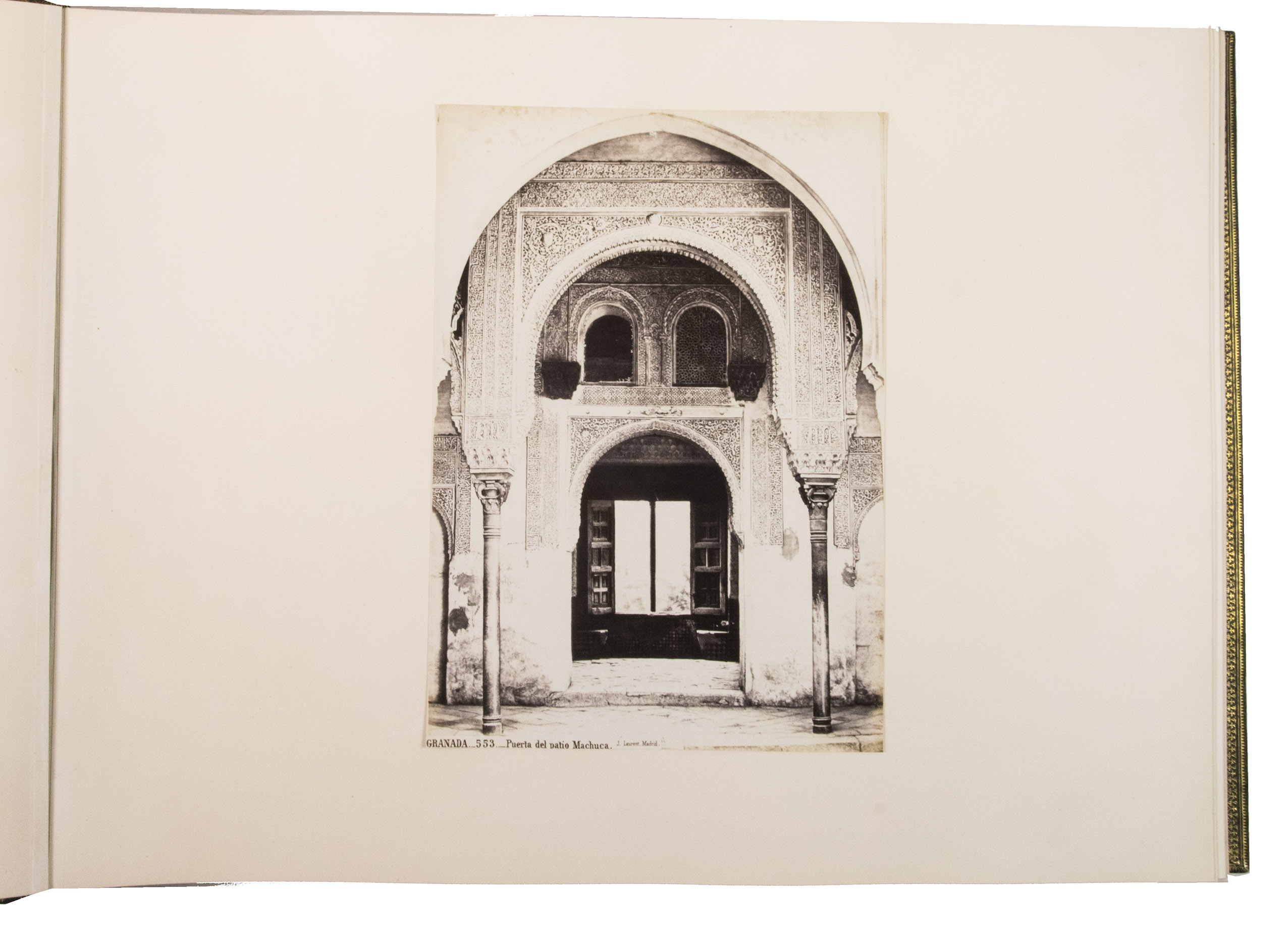 [PHOTOGRAPHY - ALHAMBRA - ISLAMIC ARCHITECTURE]. LAURENT, Jean (photographer). - [Photograph album containing pictures of Spain and its Islamic architectural treasures].[Madrid, ca. 1870s]. Oblong folio (62 x 46.5 cm). With 72 large size albumen photographic prints with architectural views, including numerous views of Spanish and Western Islamic architectural treasures, 3 large composite photographic panoramas, and 5 photographs of people. 58 of the 72 photographs contain the name of photographer, title and number of the image in the negative. Contemporary gold- and blind-stamped green leather, green watered silk endpapers, gilt edges.