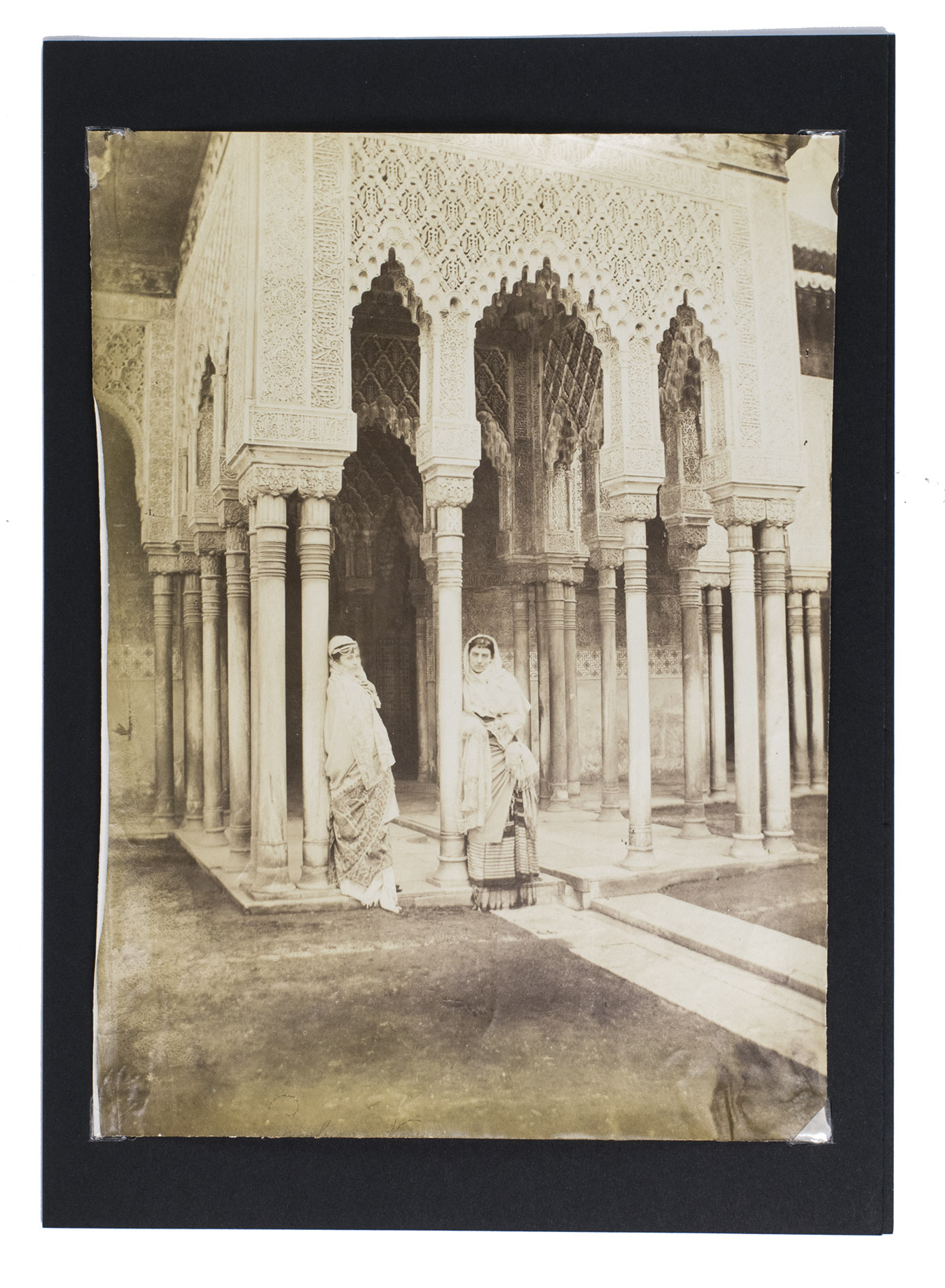 [PHOTOGRAPHY - ALHAMBRA]. MAUZAISSE, Charles (photographer). - [Collection of 13 photographs of the Alhambra in Granada].[Granada, ca. 1865]. All albumen photographic prints (18 x 24 cm) are mounted on black card stock (29.5 x 21 cm).
