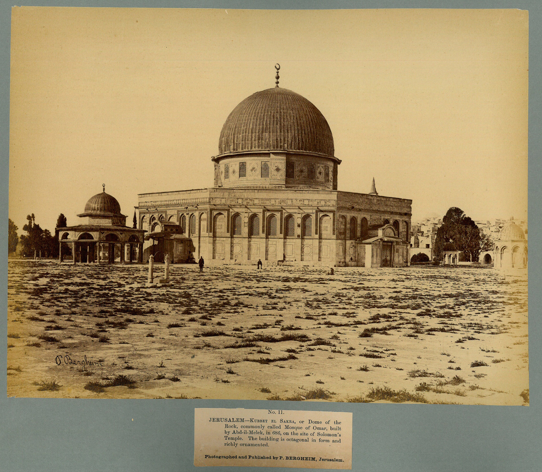 BERGHEIM, Peter. - Views of Jerusalem and Environs.Jerusalem, [late 1860s]. Box: 43.8 x 34.5 x 7.3 cm. A suite of 48 albumen photographs (ca. 22 x 29 cm) mounted on modern cardstock (40.5 x 31.3 cm), mostly with original printed captions pasted beneath the image, with tissue guards. Stored in an archivel chemise in a modern gold-tooled red cloth box, incorporating the original gold-lettered red cloth album cover (original back cover gold-tooled vignette showing the Dome of the Rock recessed on the inside of the lid of the box).