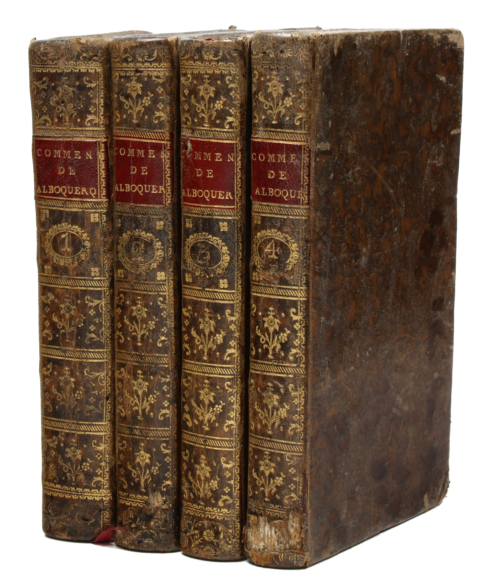 ALBUQUERQUE, Alfonso de. - Commentarios do grande Afonso Dalboquerque capitao geral que foi das Indias orientaes em tempo do muito poderoso rey D. Manuel o primeiro deste nome.Lisbon, Regia officina typografica, 1774. 4 volumes. Small 8vo. With a woodcut of Albuquerques coat of arms on all four title-pages, engraved portrait, an engraved illustration above the dedication, large engraved folding map and woodcut illustration in text. The map reaches from Egypt and Madagascar in the west to the Philippines and New Guinea in the east, including the Arabian Peninsula, the south of China, the east coast of Africa and most of the East Indies. Contemporary Portuguese mottled sheepskin with gold-tooled spines with red title labels, blue sprinkled edges, marbled endpapers.