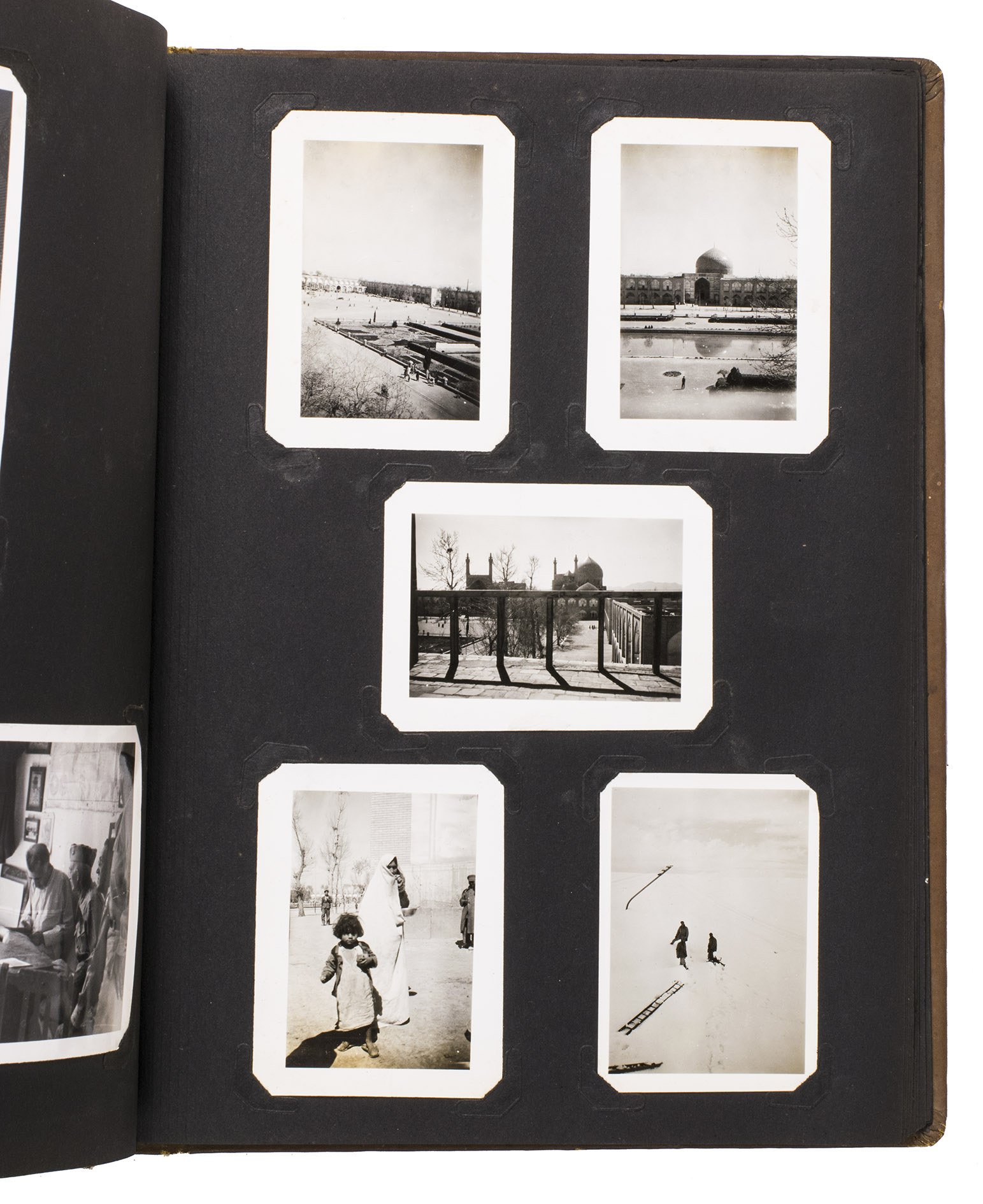 [PERSIAN GULF COMMAND]. THOMAS, Colonel S. Morgan (compiler). - [Cover title:] Persian Gulf Command. Col. S. M. Thomas. Iran.[Ca. 1943-1945]. Ca. 32.5 x 26 cm. With 76 gelatin silver photographs (various sizes). Contemporary embossed brown cloth, with the title embossed in silver on the front board, the name of the owner painted in silver, and the green shoulder sleeve insignia of the Persian Gulf Command embedded in the front board.