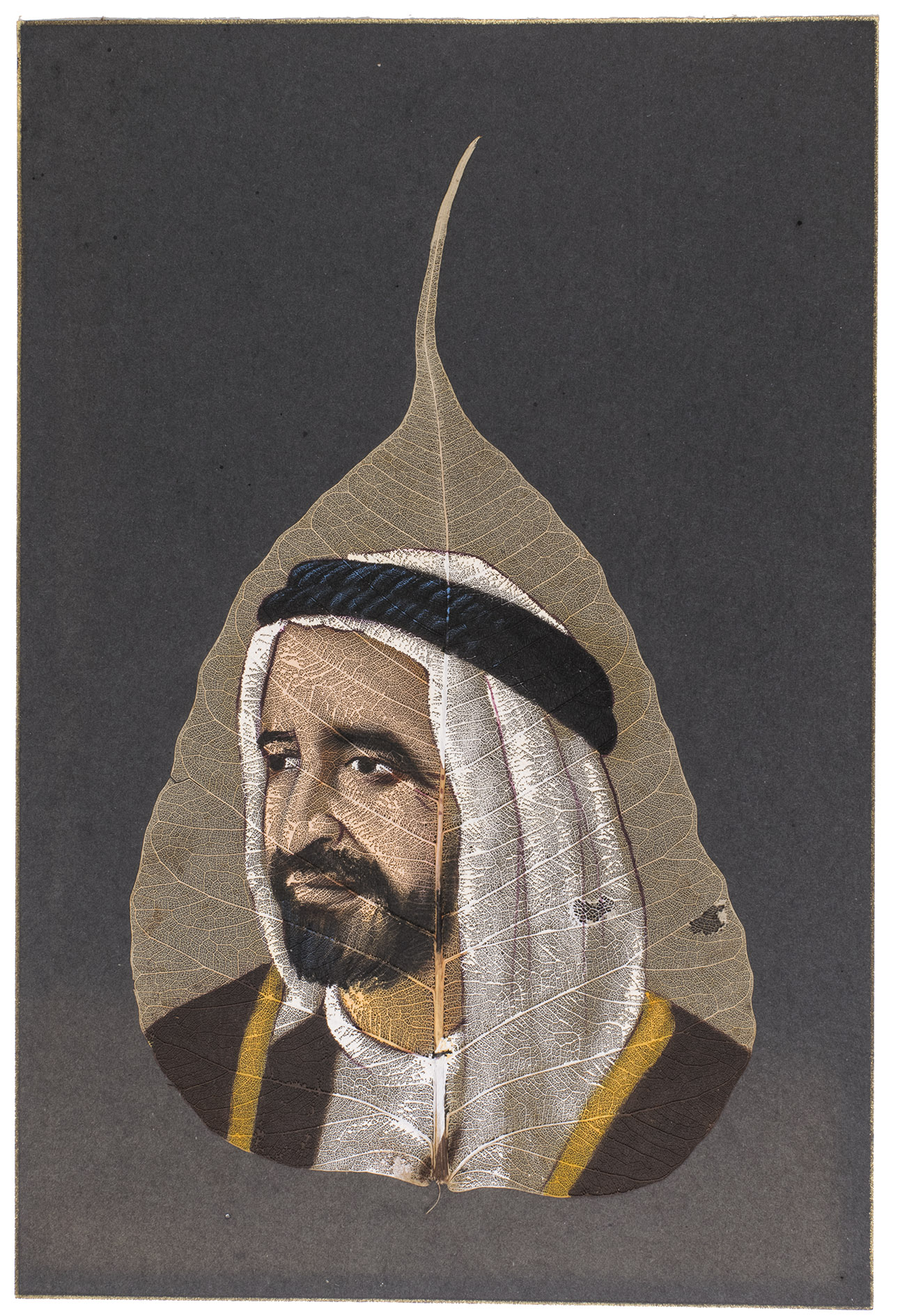 [PAINTED PEEPAL LEAF]. - [Sheikh Rashid Bin Saeed Al Maktoum].[Late 20th or early 21st century]. Ca. 23 x 13.5 cm. One painting. The leaf is placed on top of a black cardstock with a gold painted border around the edge.