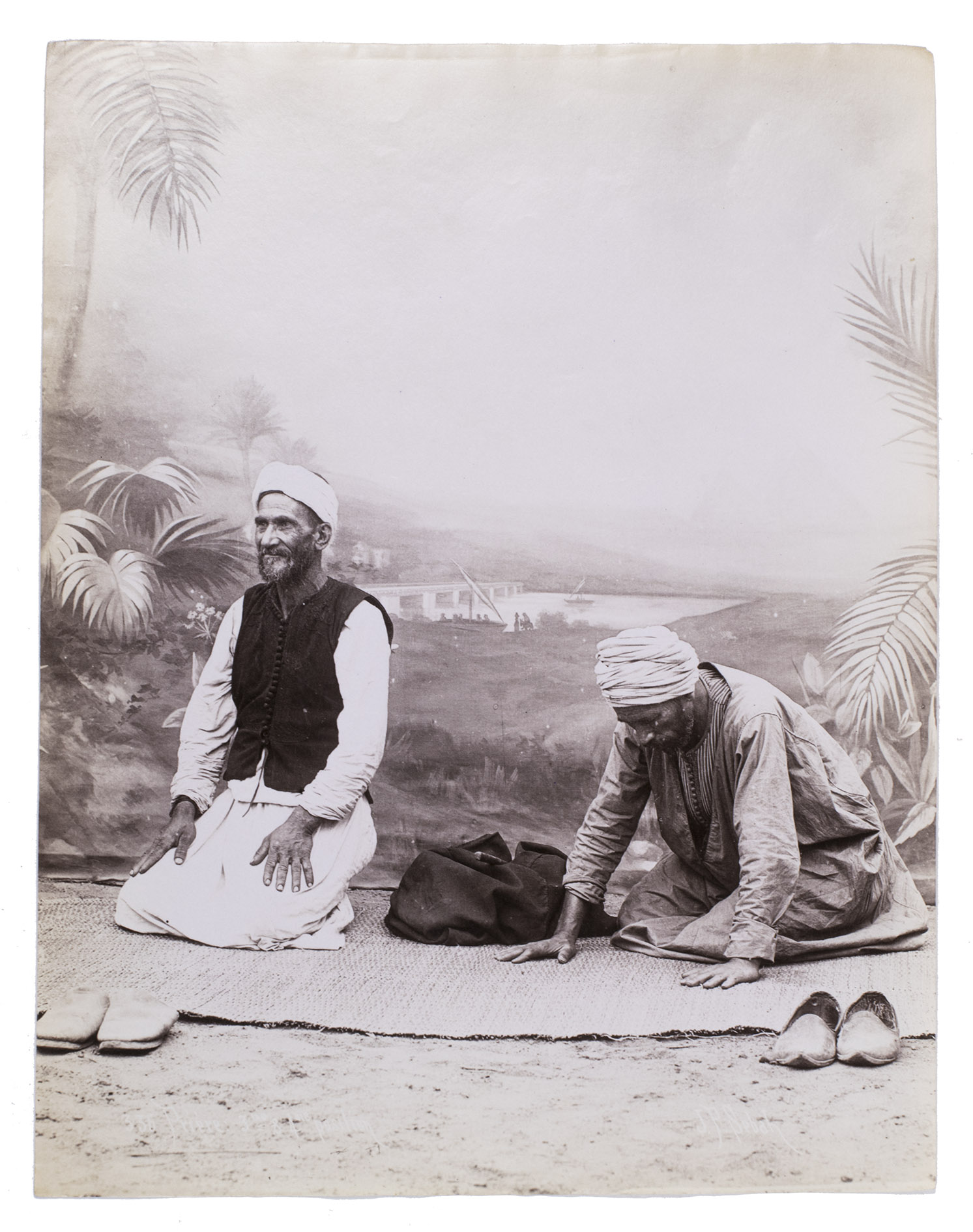 SBAH, Jean Pascal (photographer). - [Raka'ah demonstration].[Late 19th century]. Two albumen prints (each ca. 27 x 21 cm), signed and numbered in the negative. Housed in a clear plastic sleeve.