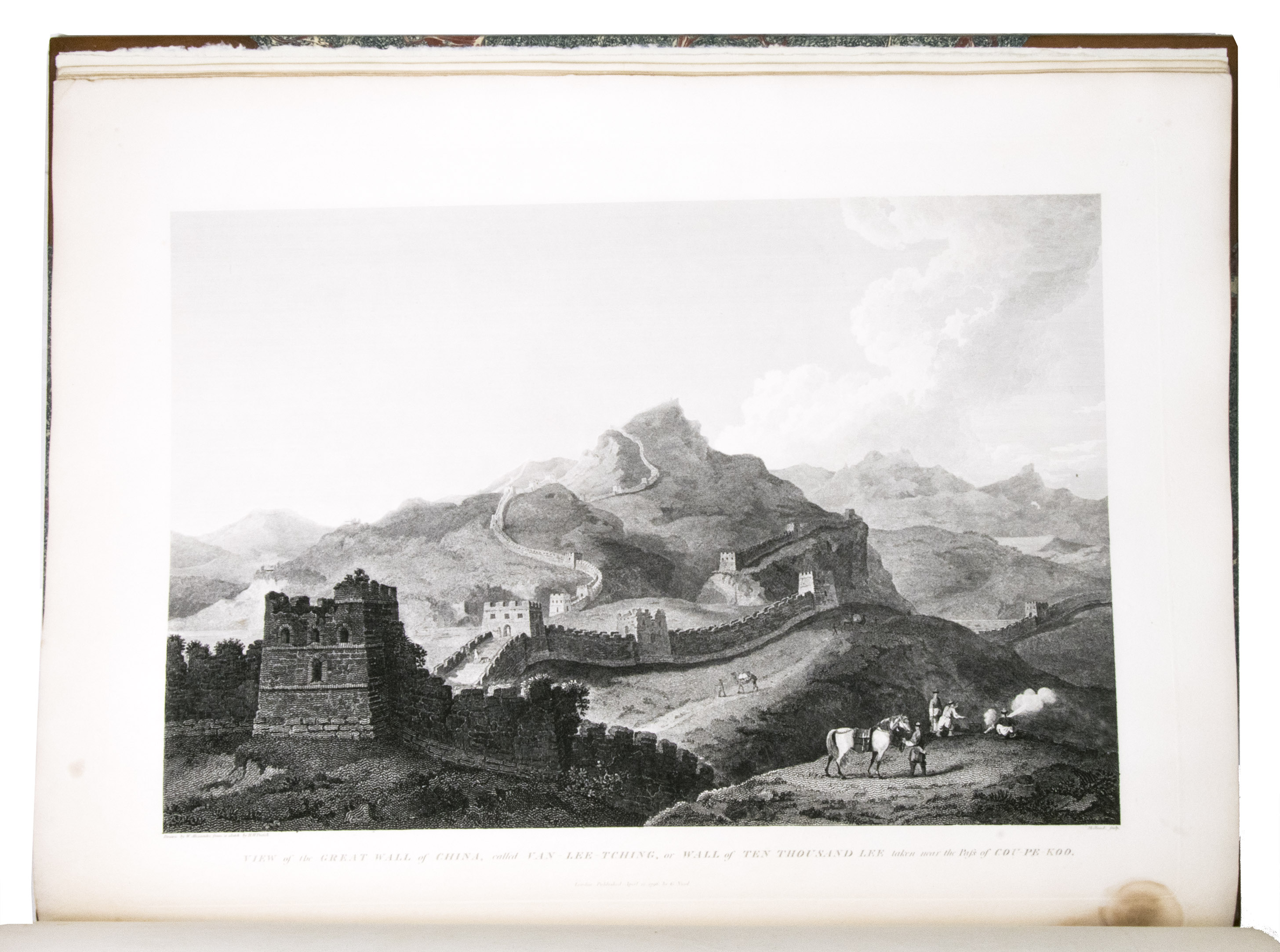 STAUNTON, George Leonard. - An authentic account of an embassy from the king of Great Britain to the emperor of China.London, W. Bulmer and Co. for G. Nicol, 1798. 2 text volumes and 1 plate volume. 4to and folio plate volume. With 44 engraved plates in the atlas (1 folding map, 6 double-page plates and 37 full-page), 2 frontispieces in the text volumes (1 each), 1 full-page plate, and 25 vignettes in the text. Early 19th-century elaborately gold- and blind-tooled brown calf, with a red morocco title label and green morocco author and volume label on the spine, gold-tooled edges and turn-ins, marbled end papers. The atlas in gold-tooled half brown calf, with the same spine as the text volumes, marbled paper sides.