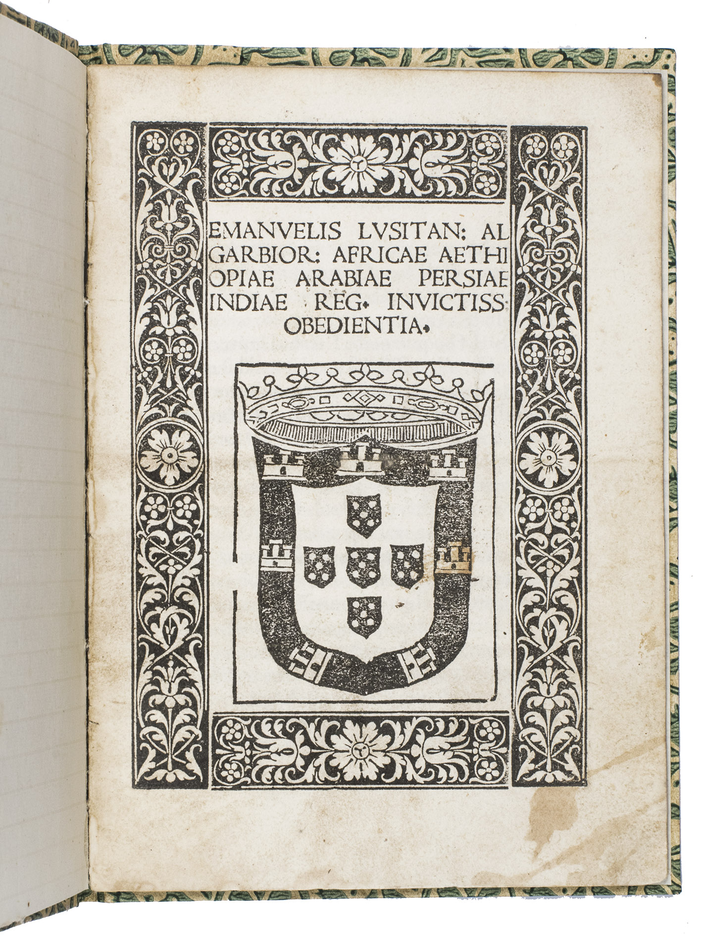 [MANUEL I, king of Portugal, and Diego PACHEGO]. - Emanuelis Lusitan. Algarbior. Africae Aethiopiae Arabiae Persiae Indiae reg. invictiss obedientia.[Rome, Marcello Silber, 1514]. Small 4to (ca. 19.5 x 14 cm). With the woodcut coat of arms of King Manuel I on the title page, surrounded by a woodcut floral border. 19th-century decorative paper with a pattern of green flowers.