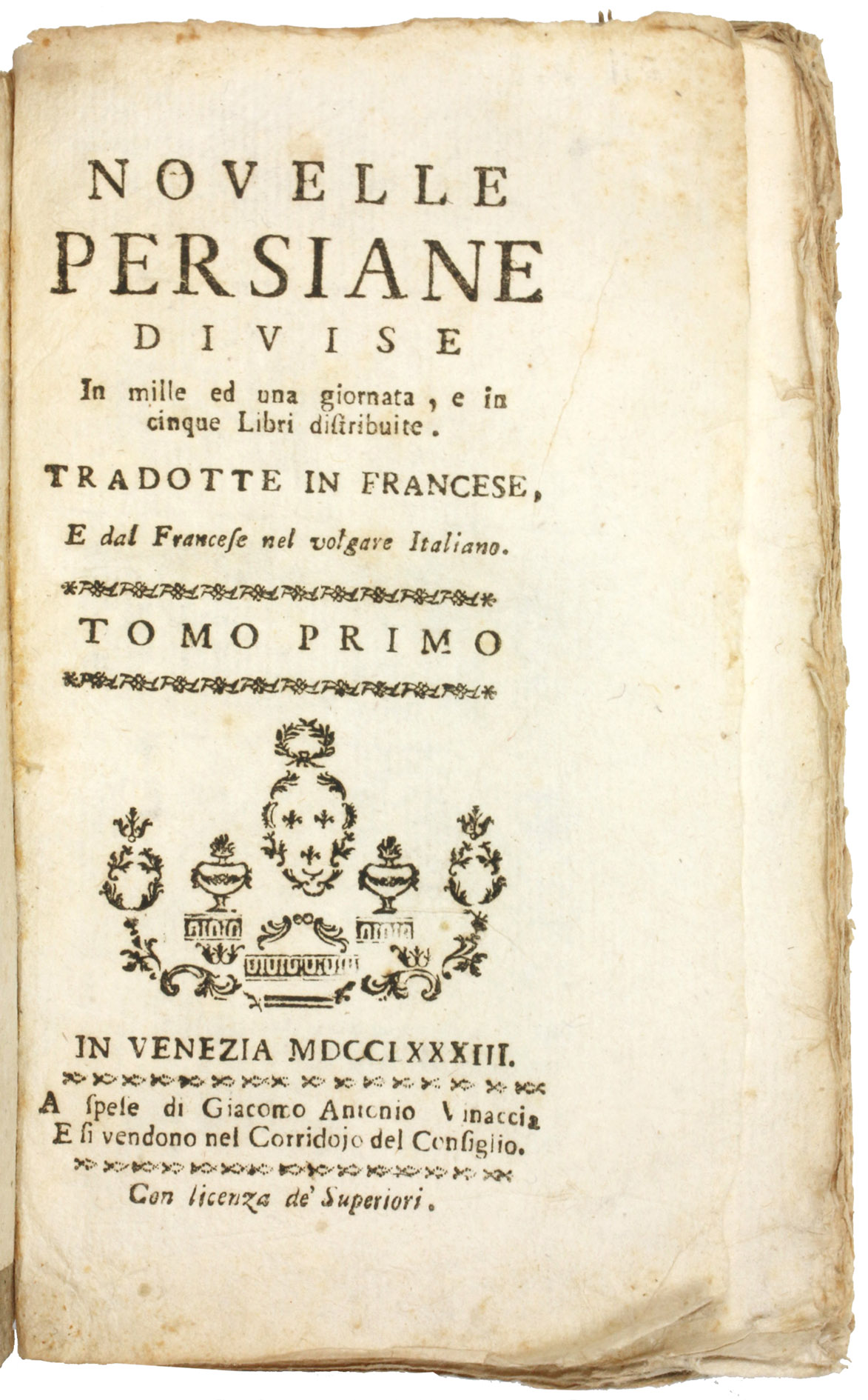 [THOUSAND AND ONE DAYS - ITALIAN]. - Novelle persiane divise in mille ed una giornata, e in cinque libri distribuite. Tradotte in francese e dal francese nel volgare Italiano. Vol. primo [-quinto]. Venice [= Naples?], Giacomo Antonio Vinaccia, 1783. 5 volumes. 12mo. With vignettes built up from typographical ornaments on each title page and some ornamental headpieces. Contemporary grey paper wrappers with manuscript volume numbers on the spines. Stored in a brown decorated paper slipcase.