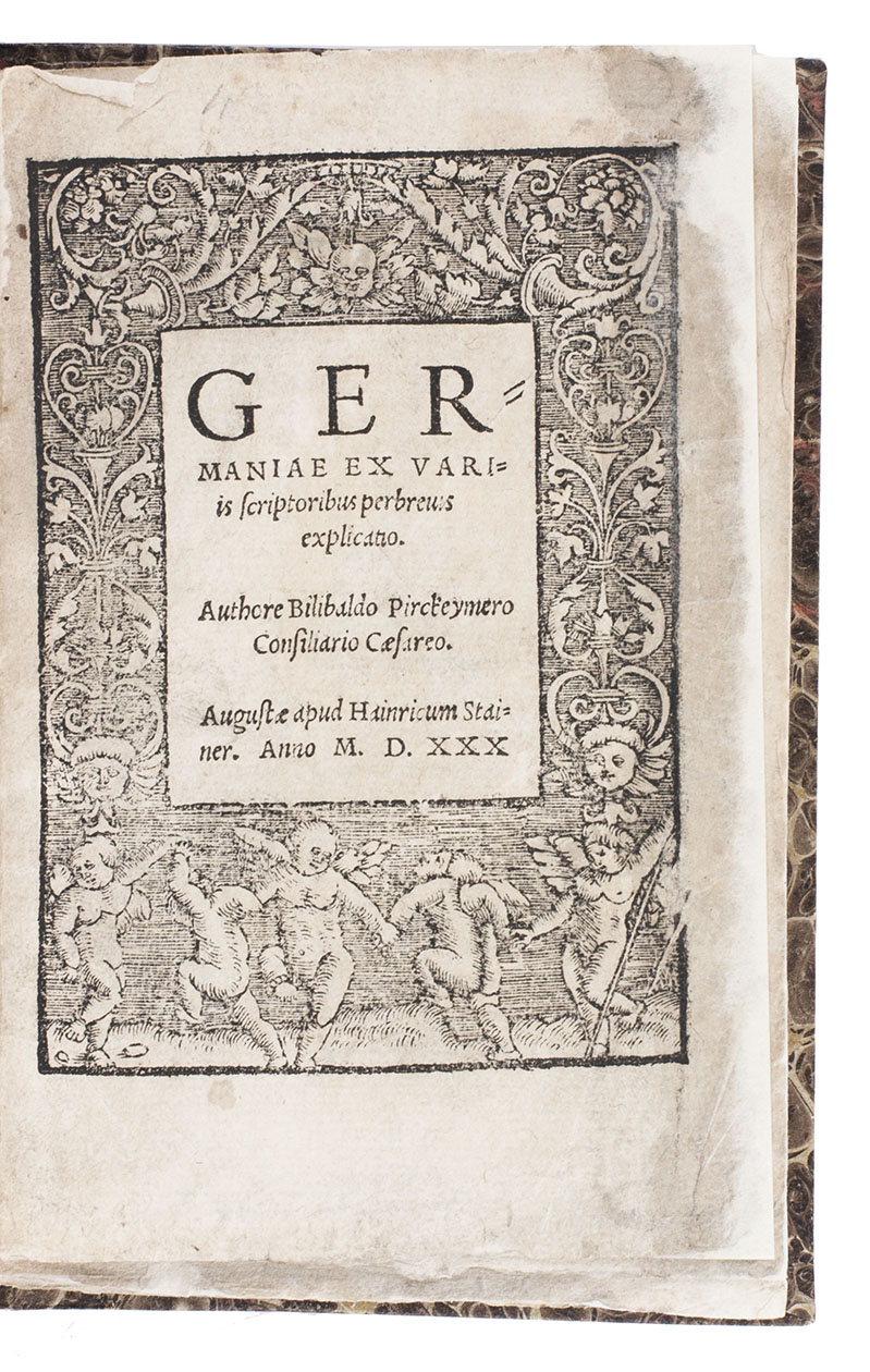 PIRCKHEIMER, Willibald. - Germaniae ex variis scriptoribus perbrevis explicatio.Augsburg, Heinrich Steiner, 1530. Small 8vo (15.5 x 10.5 cm). Title in a wide woodcut ornamented border, 2 woodcut historiated initials. Set in an Aldine-style italic with a word of Greek. Modern brown shell-marbled boards.