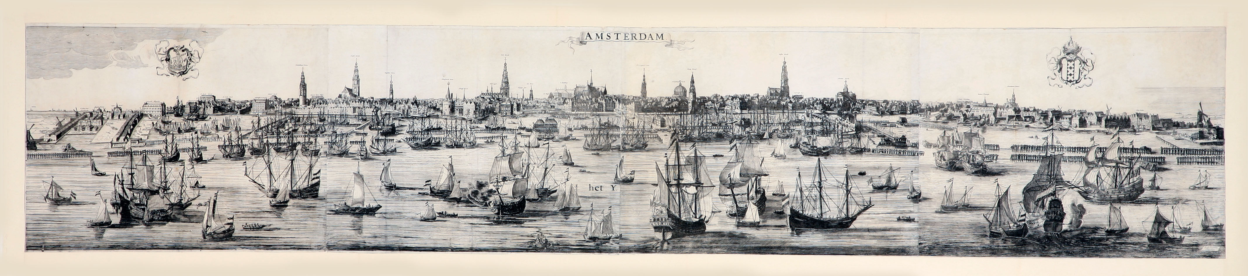 [VIEW - NETHERLANDS - AMSTERDAM]. OTTENS, Reinier and Josua OTTENS. - Amsterdam.[Amsterdam], Reinier and Josua Ottens, [ca. 1730]. Large engraved panorama on 4 sheets (ca. 42 x 218 cm as assembled). With title in banner at top centre, arms of the city at top right, city seal at top left and the primary locations with captions. Mounted and framed.