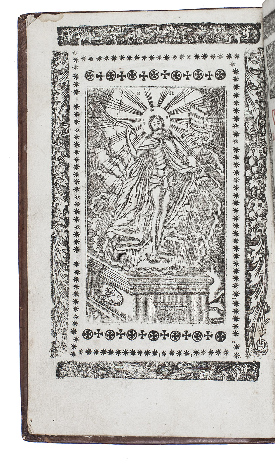 [PRAYERBOOK - RUSSIAN ORTHODOX - KIEV LITURGY]. - Posledovanie na den' s[via]tyia Paskhi i na vsiu svetluiu sedmitsu [=Order for the Holy Day of Easter and for the whole of Easter week]. Kiev, Pechersk Lavra (Monastery of the Caves), [ca. 1801]. 8vo in 4s (18.511.5 cm). Easter liturgy in Old Church Slavonic, with title-page and about 20 other pages printed in red and black, the title in a woodcut border and with a woodcut Paschal lamb, a full-page engraving of Jesus's Resurrection on the back of the title-page, and all pages after the title-page with borders made up of 4 woodcut strips. Set in 3 sizes of Old Slavonic poluustav cyrillic type. Printed on laid paper with a blue-green cast. Contemporary gold-panel-stamped and gold-tooled calf by the Kiev Monastery of the Caves, with a panel stamp of Jesus on the front board and a panel stamp of Maria on the back, gilt edges.