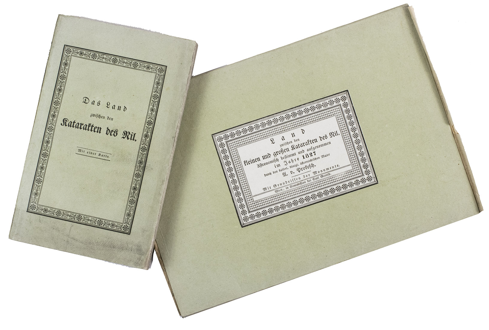 PROKESCH, Anton, Ritter von Osten. - Das Land zwischen den Katarakten des Nil. Mit einer Karte, ...Vienna, Carl Gerold, 1831. 12mo (the book) and 17.5 x 25 cm (the folder with the folded map). With a separate large folding lithographed map (98 x 69 cm; image area 93 x 64 cm) assembled from 2 sheets, with the cultivated areas along the river hand-coloured in green as published, also showing 17 floor plans of temples and a plan of a Roman wall. The book in the publishers original light green paper wrappers and the map in a matching green paper folder.