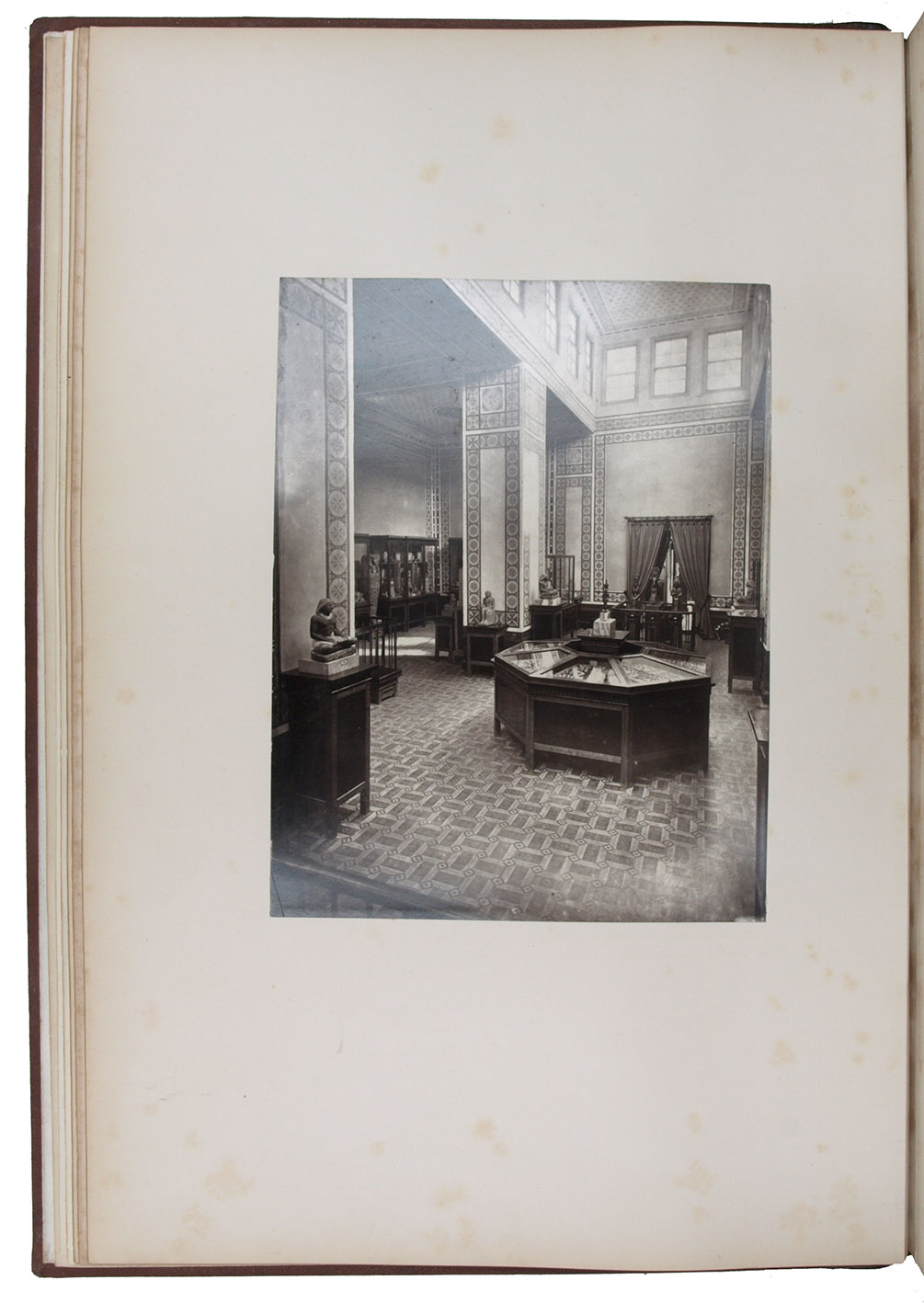 MARIETTE-BEY, Auguste. - Album du muse du Boulaq comprenant quarante planches photographies par MM. Deli et Bchard, avec un texte explicatif rdig par Auguste Mariette-Bey.Cairo, Mours & Cie, 1872. Folio. With 40 original, albumen photographic prints (ca. 24.5 x 18 cm) on stiff paperboard mounted on hinges. Original publishers half brown morocco, blind stamped cloth over boards, with title and figures in gold, gilt edges.