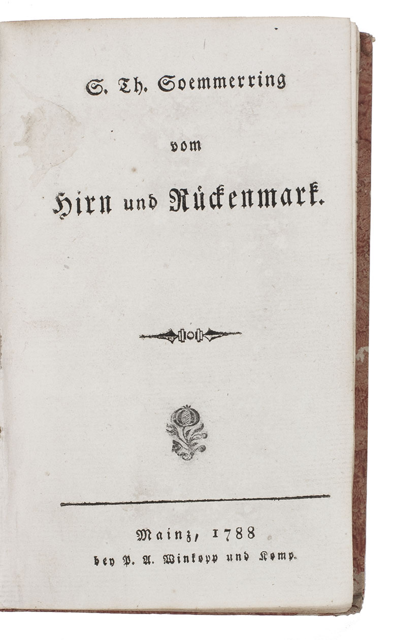 SOEMMERRING, Samuel Thomas von, the younger. - Vom Hirn und Rckenmark.Mainz, P.A. Winkopp & Komp., 1788. Small 8vo (15.5 x 9.5 cm). With a decorated rule on the title-page and a few decorations built up from cast fleurons. Set in fraktur types with Latin words in italic and non-German book titles in roman. The present copy has a pomegranate stamped on the title-page after printing and folding but before binding. Near contemporary boards covered with orange paste-paper, gold-tooled spine label, orange and brown sprinkled edges.