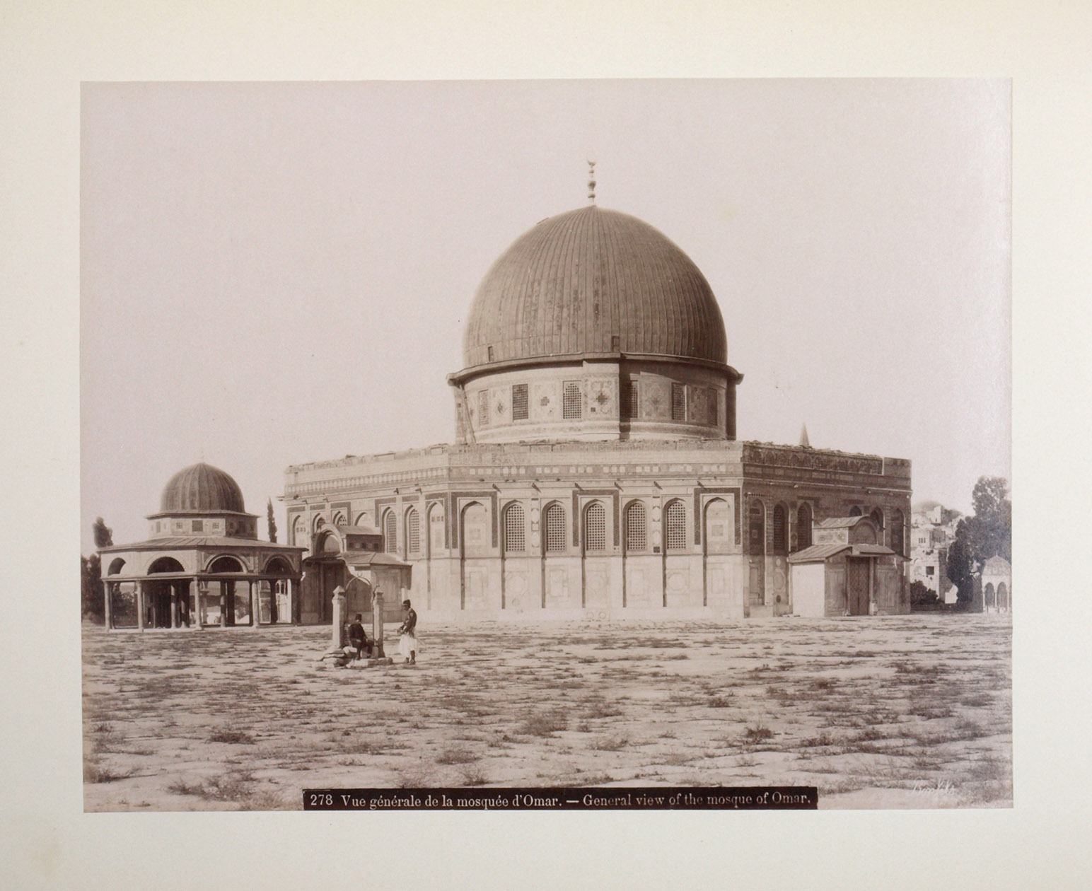 [BONFILS, Flix]. - Jerusalem.[Palestine, 1880s]. Oblong album (44.5 x 31.5 cm) With 71 large photographic albumen prints, mostly ca. 22 x 28 cm, signed and captioned in the negative (in French and English), mounted on both sides of the album's leaves. Includes a three-part folding panorama of Jerusalem from Mount Olivet, measuring 82 x 21 cm. Original auburn morocco with gold-stamped front board, gilt edges.