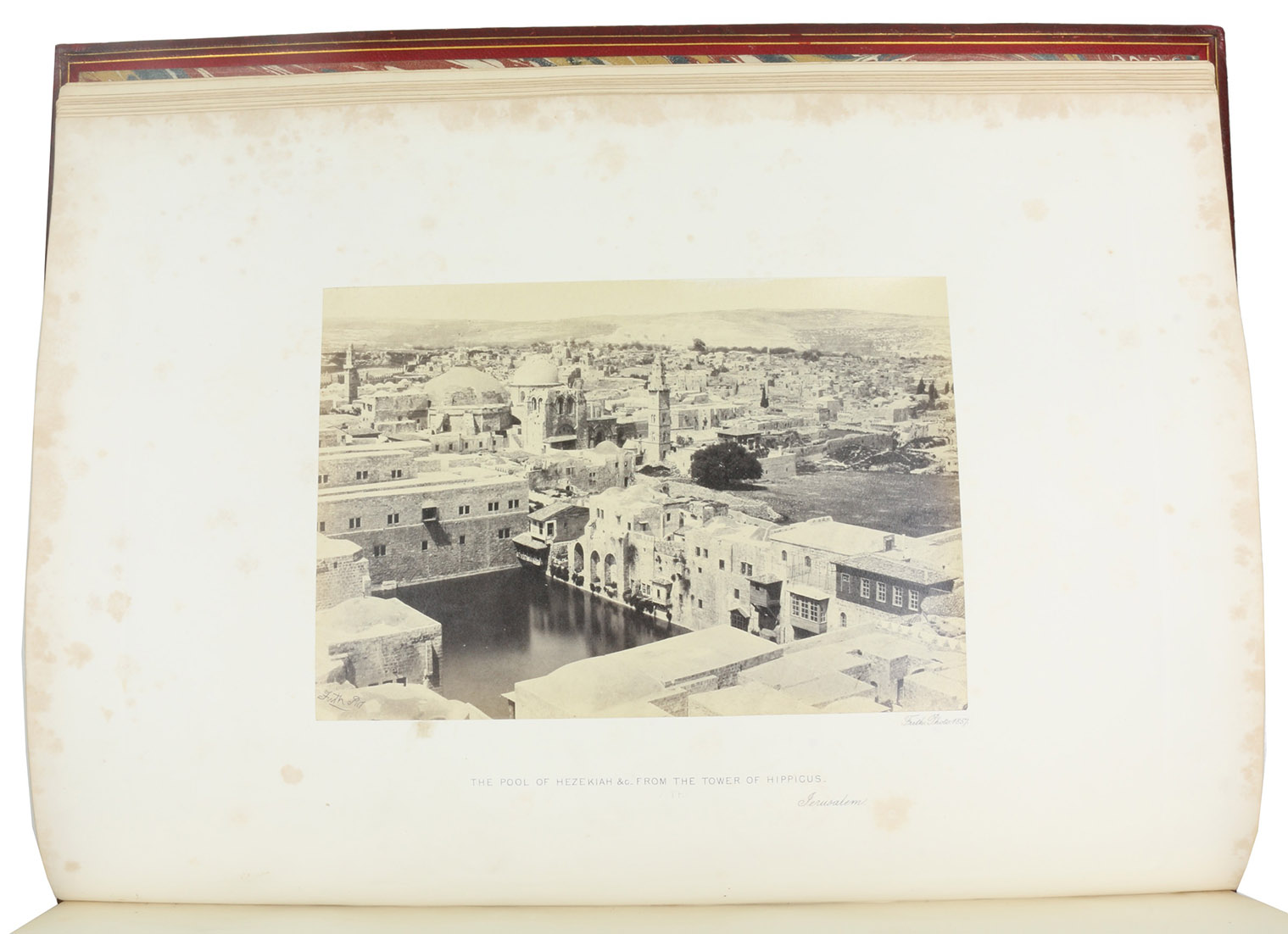 FRITH, Francis. - Egypt and Palestine. Photographed and described.London, James S. Virtue, [1858-1859]. 2 volumes. Folio (44.5 x 32.5 cm). With 76 photographs  on plates by Francis Frith (ca. 14.5-16.5 x 21.5-23 cm), each with a separate leaf of text. Contemporary red morocco, gold-tooled spines and boards, marbled endpapers, gilt edges.