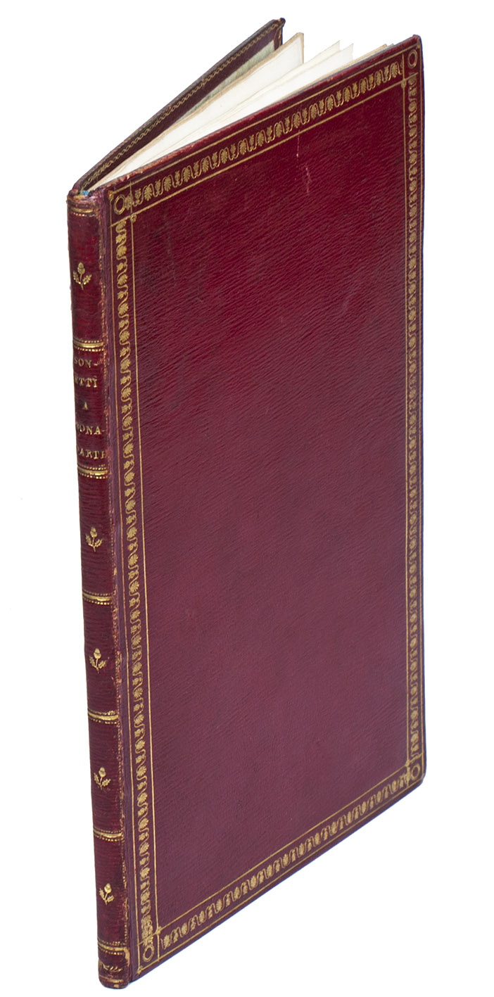 BUTTURA, Antonio. - Sonetti a Bonaparte.Paris, Pierre Didot lan, An VIII [after Floral, so 1800]. 8vo. Finely printed on vellum. Contemporary long-grained and gold-tooled red goatskin morocco, each board with a frame made from a decorated roll with palm leaves between 2 fine-line fillets, the smooth spine with the title in the 2nd of 6 fields, an acorn with leaves in each of the others, gold-tooled board edges and turn-ins, light green watered silk endleaves.