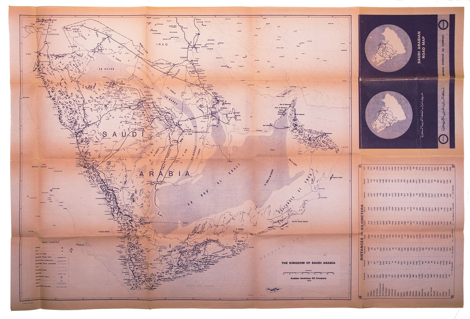 [ARAMCO]. - Saudi Arabian road map.Dammam, Al-Mutawa press company, 1973. Large folding map (60  90.5 cm), printed in light orange with darker purple, depicting the Kingdom of Saudi Arabia and its main roads. With on the right the title in both Arabic and English and a table with the distances from one city to another.